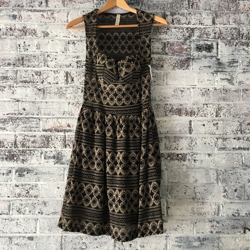 Black and gold/sheer/peekaboo dress